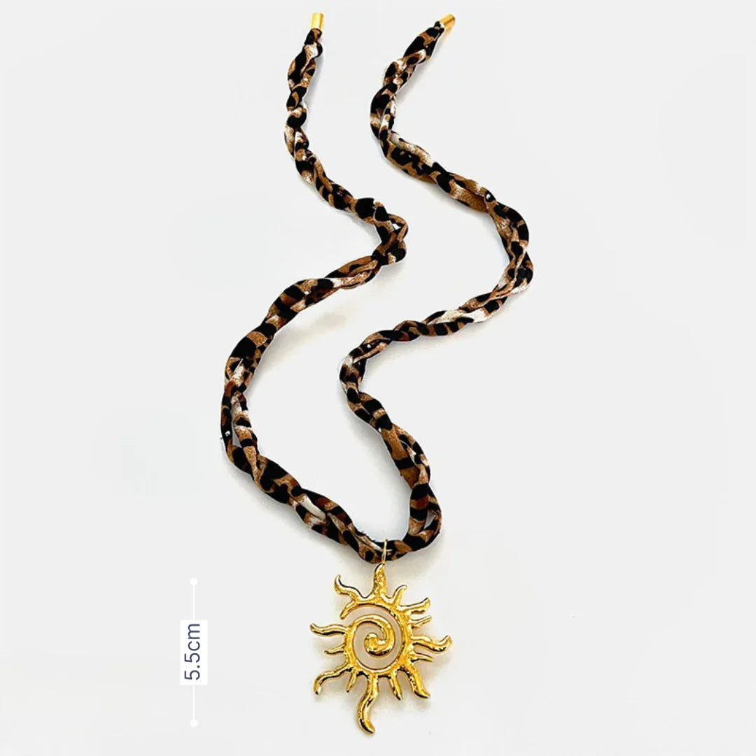 Ketting panterstof met gouden statement zon