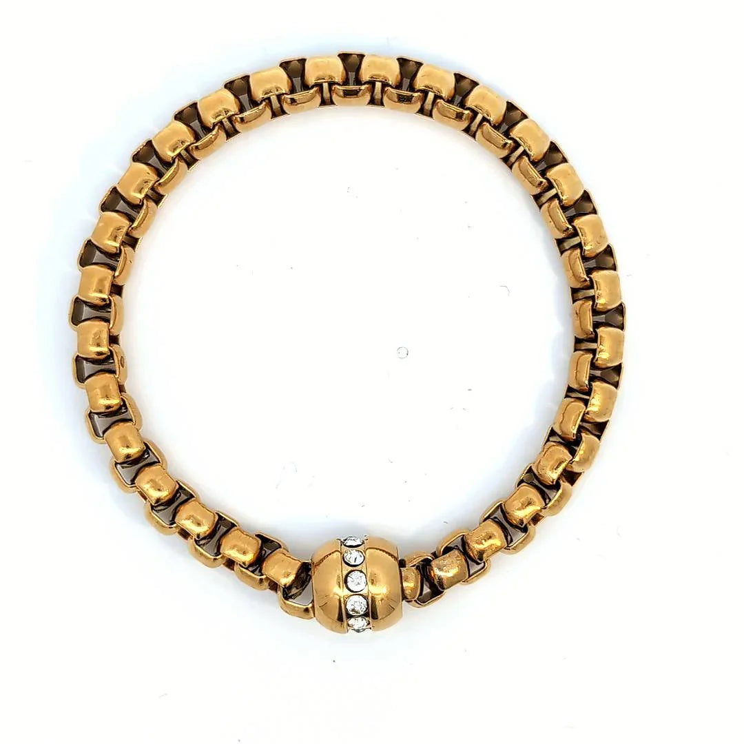 Stevige gouden schakelarmband met zirkonen ingelegde bedel - Casa Jadel
