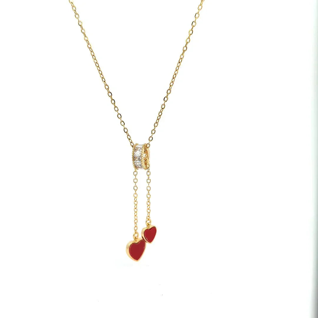 Ketting goud met een bedel en 2 rode verstelbare hartjes - Casa Jadel