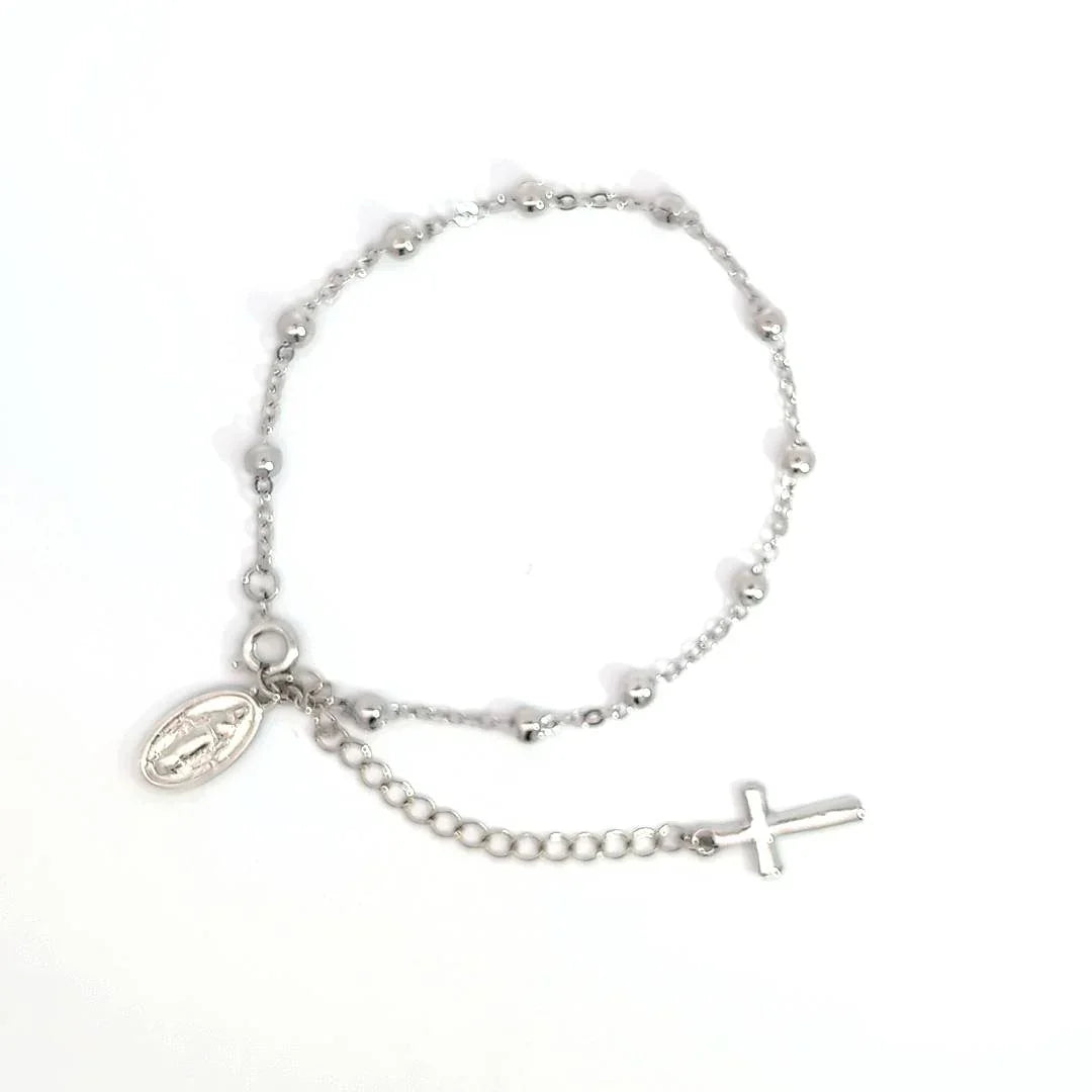 Schakelarmband zilver met bolletjes een bedeltje met heilige en aan het verlengstukje een kruis - Casa Jadel