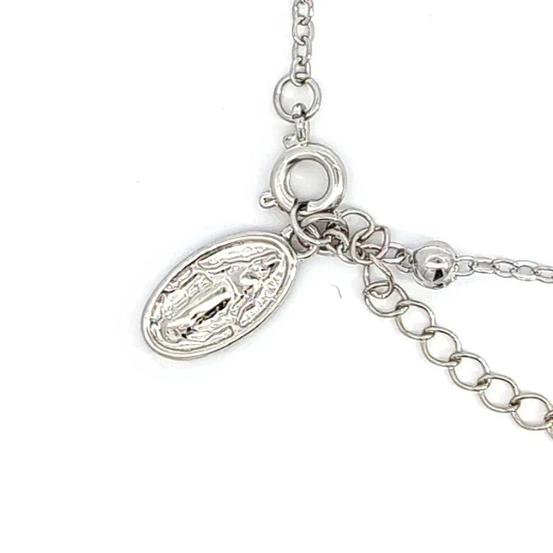 Schakelarmband zilver met bolletjes een bedeltje met heilige en aan het verlengstukje een kruis - Casa Jadel