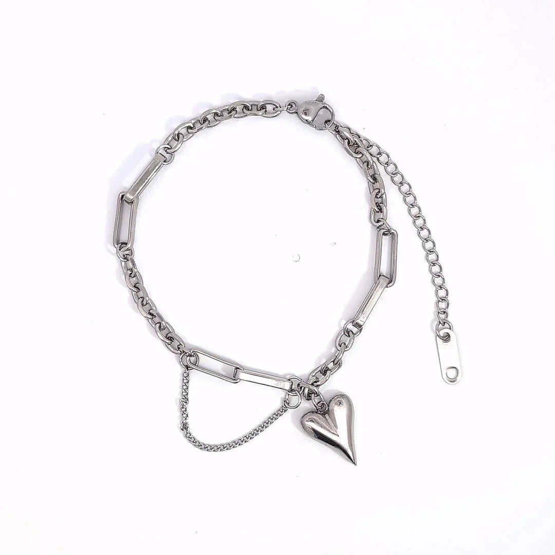 Schakelarmband zilver met verschillende schakels en hartjes bedel - Casa Jadel
