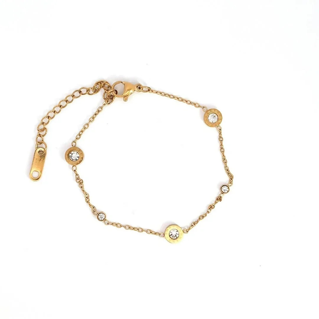Fijne gouden schakelarmband met 3 grote en 2 kleine kristallen - Casa Jadel