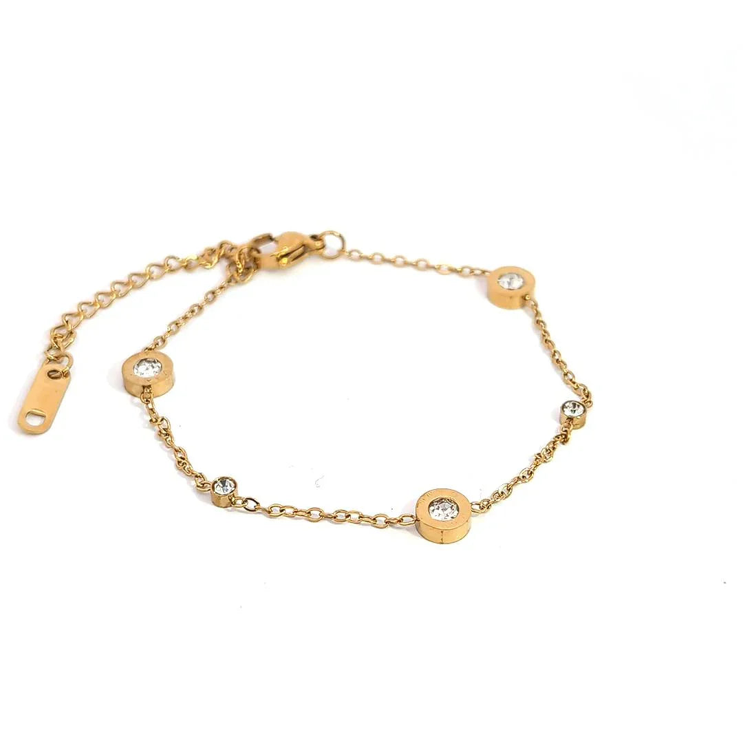 Fijne gouden schakelarmband met 3 grote en 2 kleine kristallen - Casa Jadel