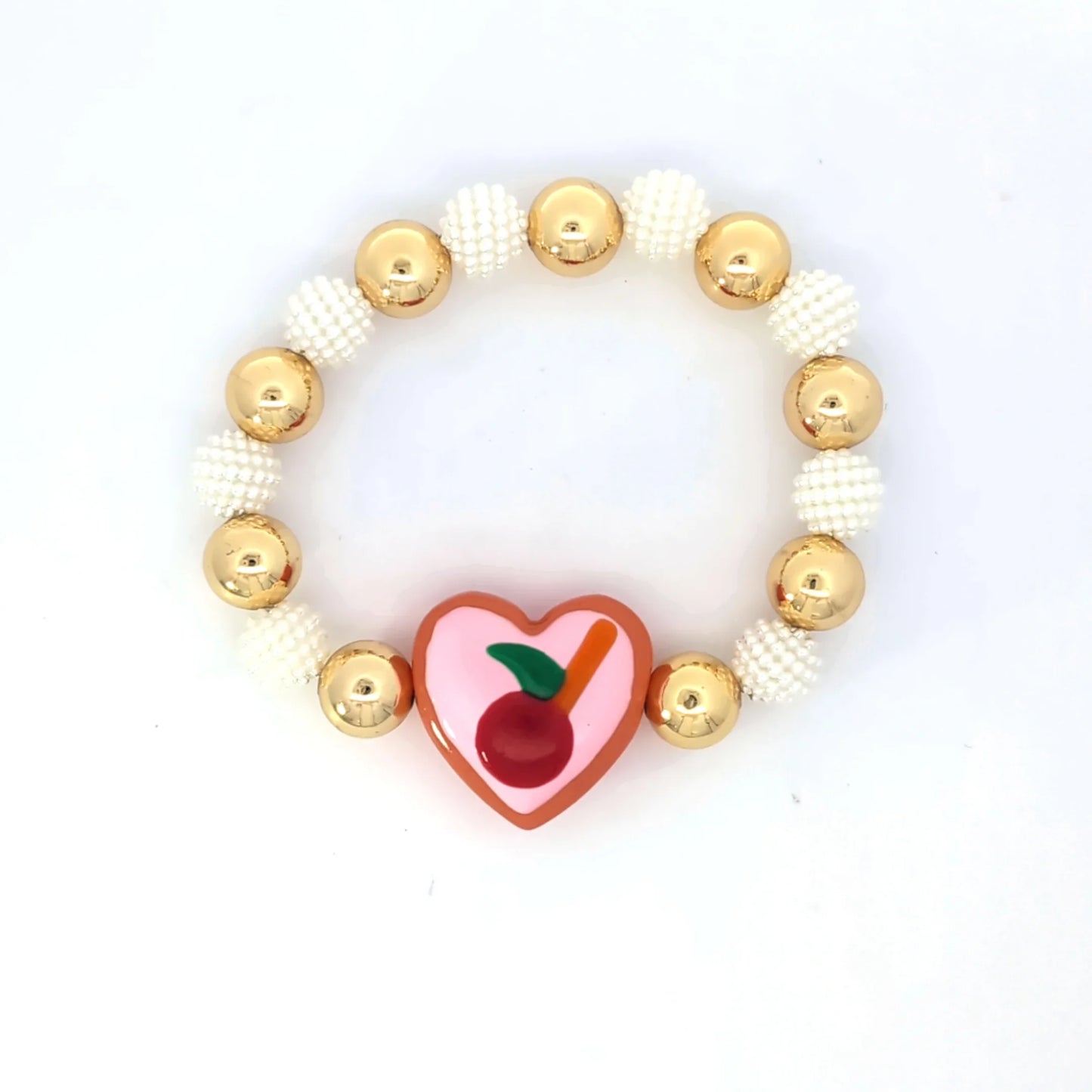 Armband goudkleurige en parelmoer kralen hartvormig roze bedel - Casa Jadel
