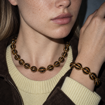 Gestreepte keramiek kattenoog set | ketting en armband