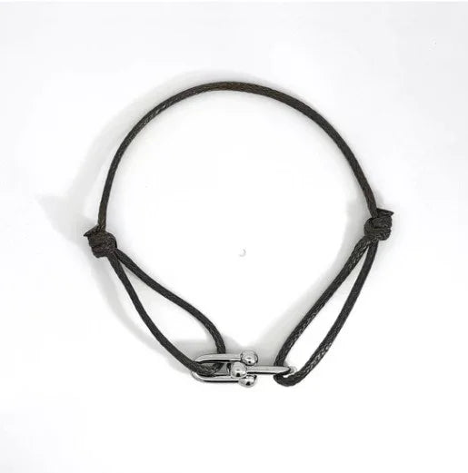 Zwart koord armbandje met zilveren dubbele bedels - Casa Jadel