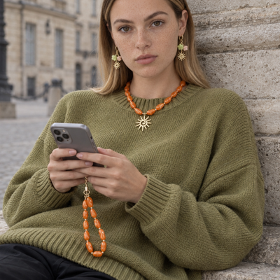 Oranje chunky marble kralenset met zonbedel | ketting en telefoonkoord