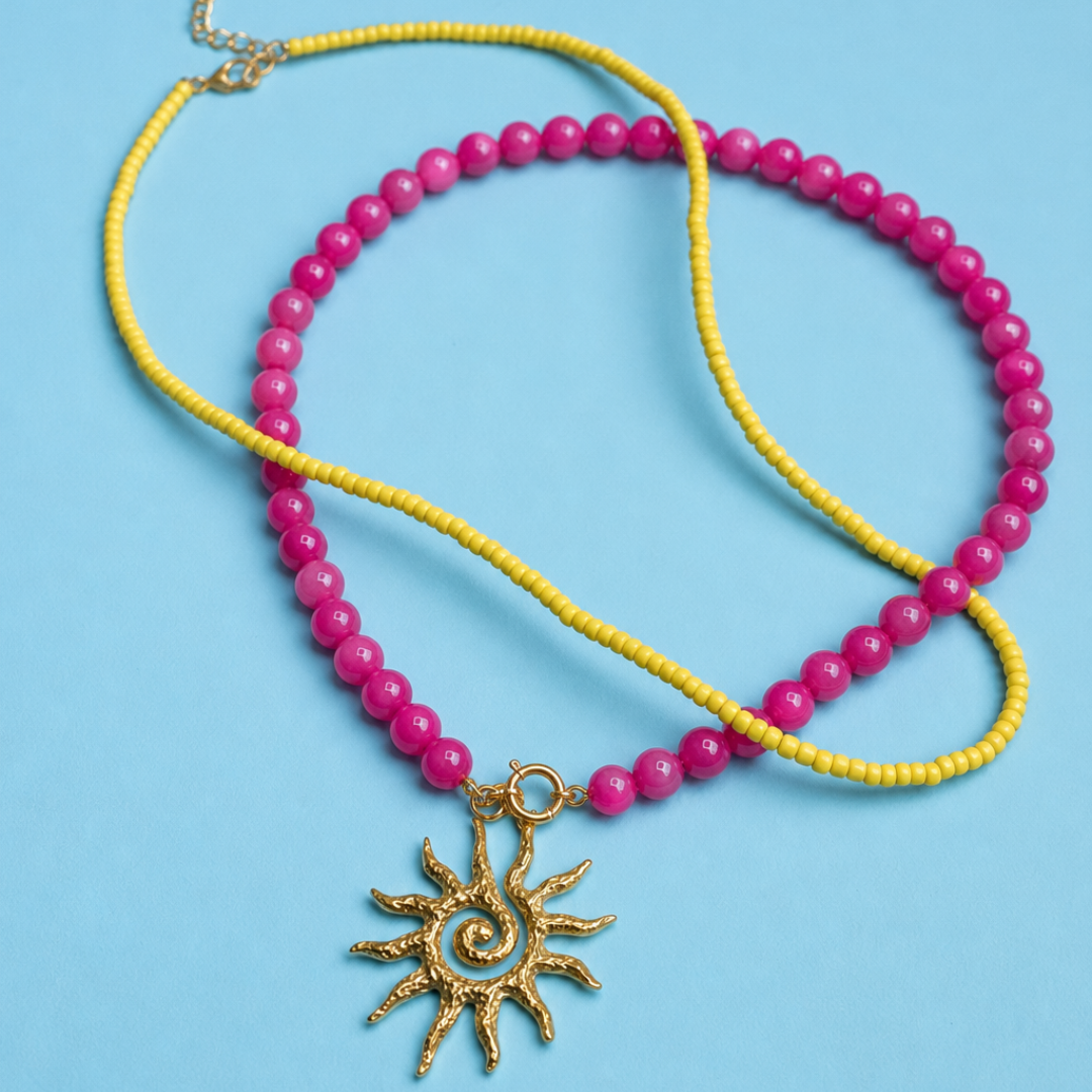 Fuchsia-gele kralenset met zon | twee kettingen en bedel