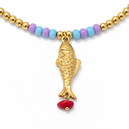 Gele kralenketting met vis bedel – pastel Ibiza ketting dames