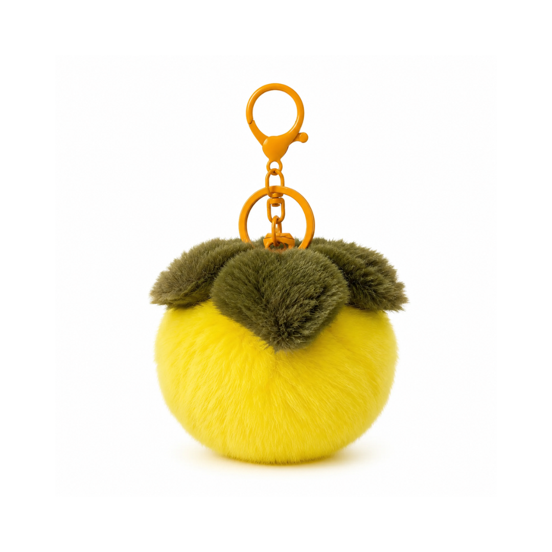 Gele kaki fruit pompon tashanger