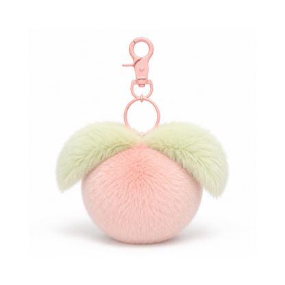 Perzikkleurige fruit pompon tashanger met hartje in perzik, groen en goudkleurig voor aan een tas