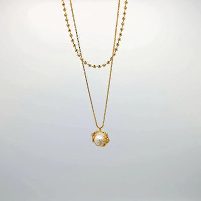 Lange dubbele ketting goud met hanger en parel