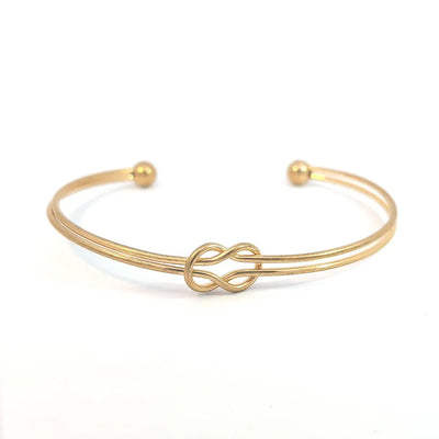 Bangle gouden draad met platte knoop