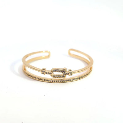 Dubbele gouden bangle armband met strass en een gesp