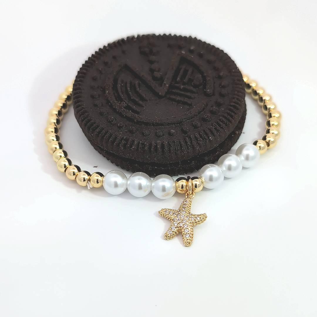 Armband met kralen en een met strass bedekte zeester bedel - Casa Jadel