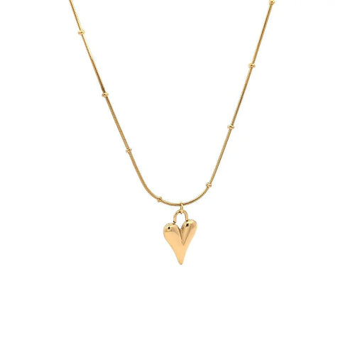 Gouden schakelketting balletjes hartjes bedel