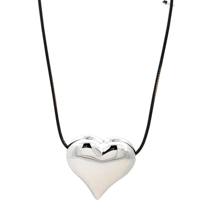 Zwart koord ketting met zilveren hart