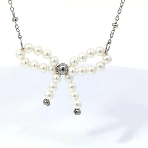 Zilveren ketting met parelkraaltjes strikje