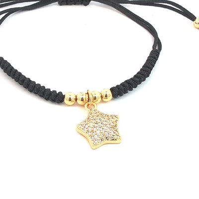 Verstelbare armband met gouden kraaltjes en ster met strass
