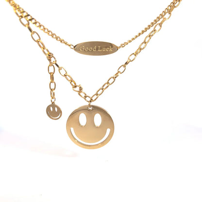 Dubbele gouden schakel ketting met smileys  en Good Luck hangertje