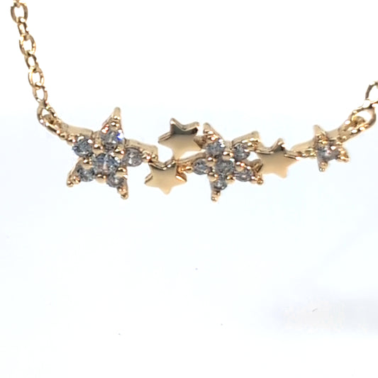 Gouden ketting met 6 sterretjes en strass