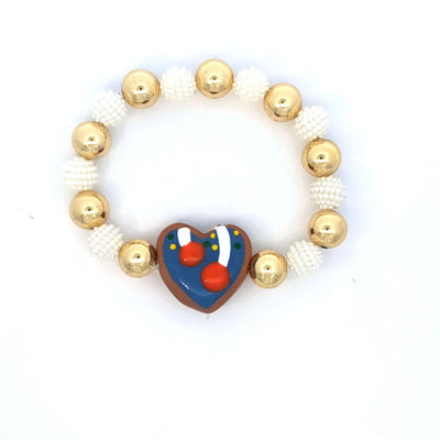 Armband goudkleurige en parelmoer kralen hartvormig blauwe bedel
