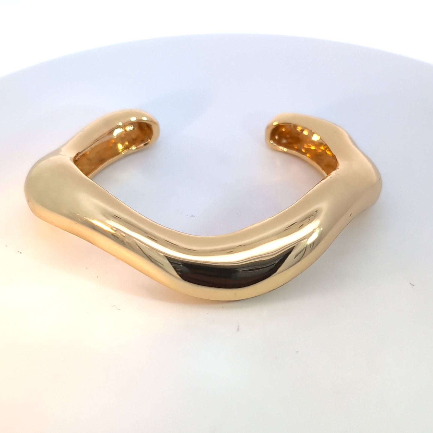 Open gouden bangle assymetrisch