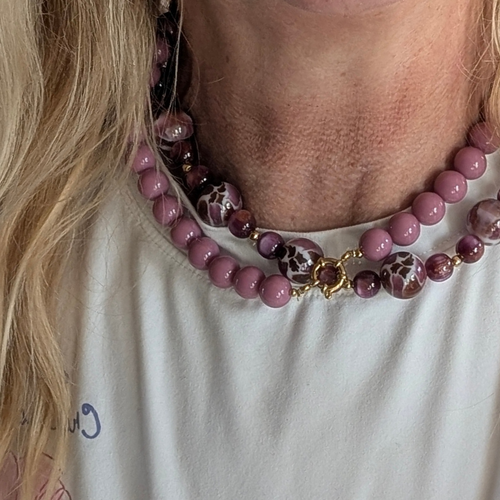 Roze kralenketting met boeislot