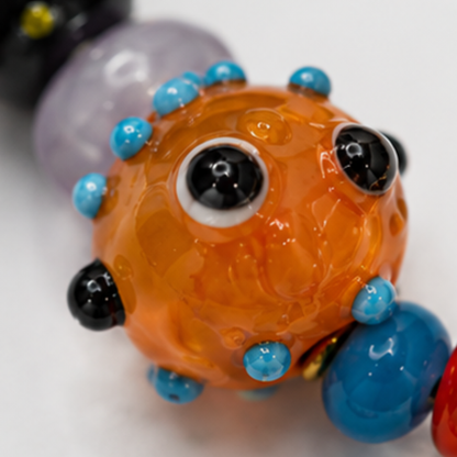 Handgemaakte trinket glazen kralenketting met gele zeester bedel