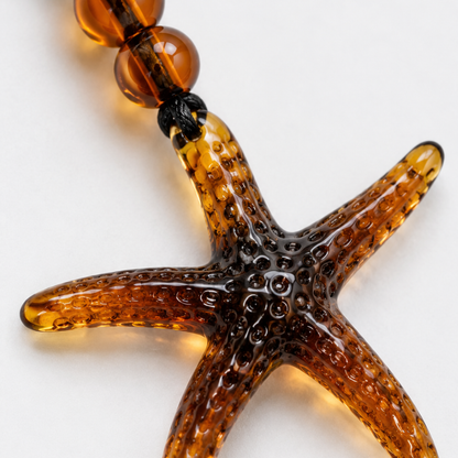 Koord ketting met amber oversized zeester