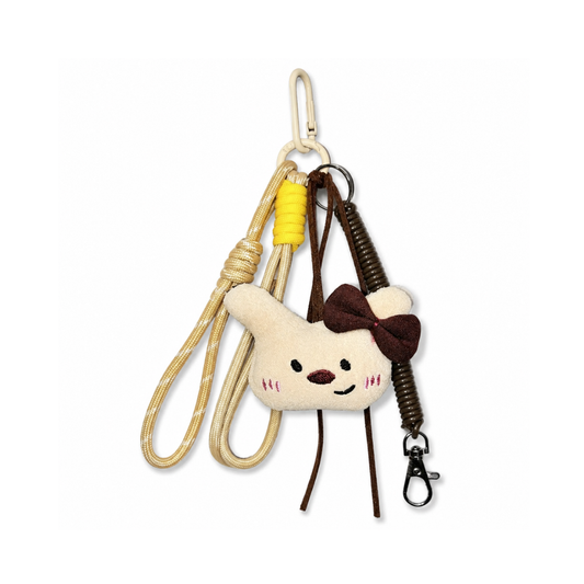 Offwhite hond tashanger met burgundy strik en spiraalkoord