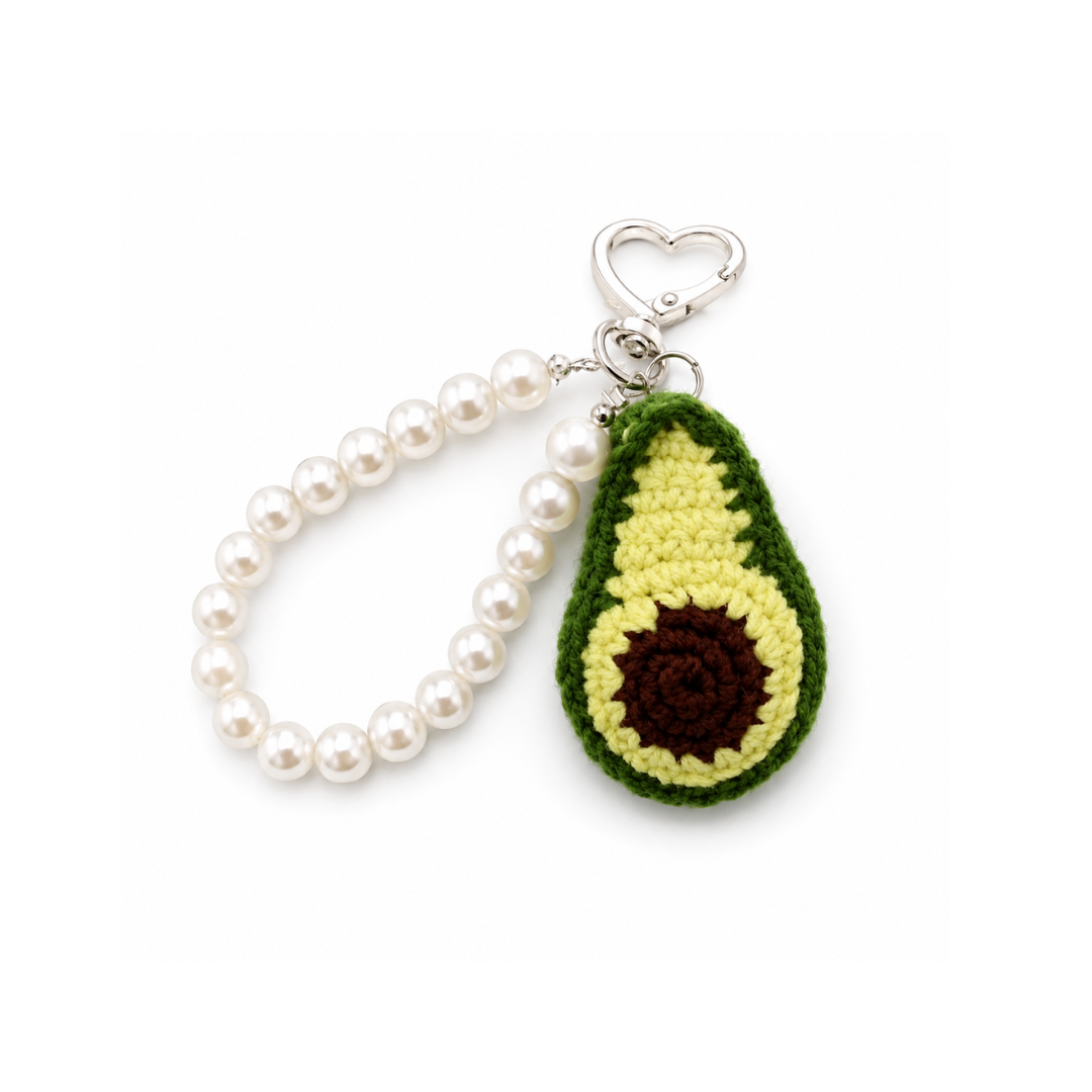 Groene gehaakte avocado met parelkralen tashanger