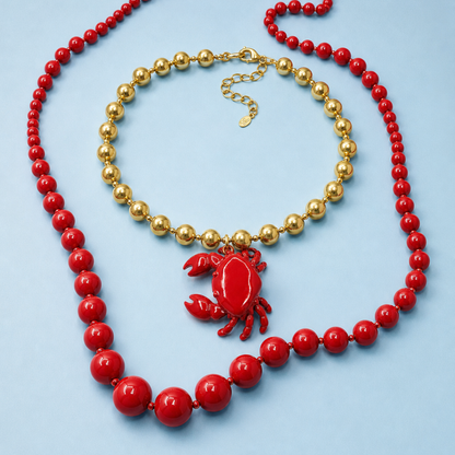 Rood-gouden statement kralenset close-up | Casa Jadel
