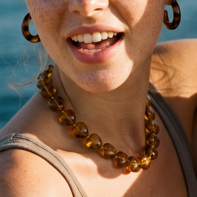 Amber bruin panterprint grote hartjes kralenketting