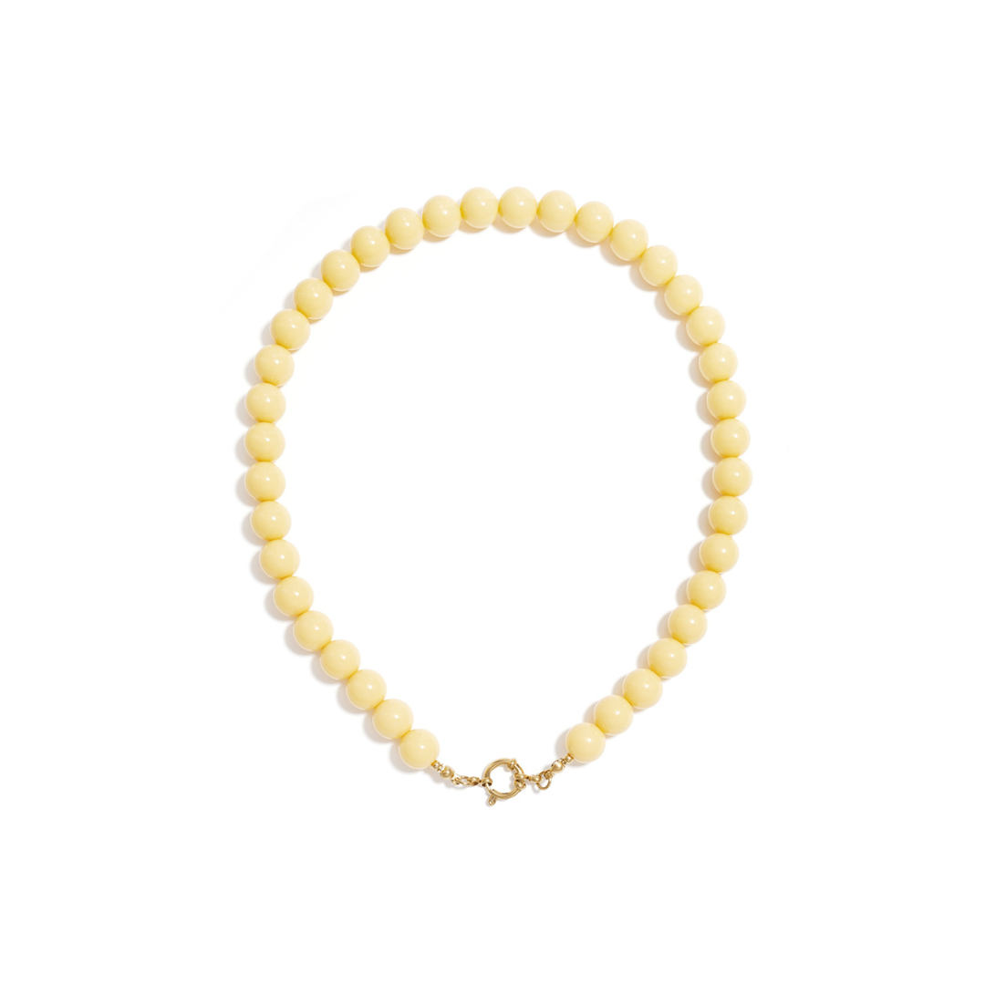 Botergele kralenketting met boeislot
