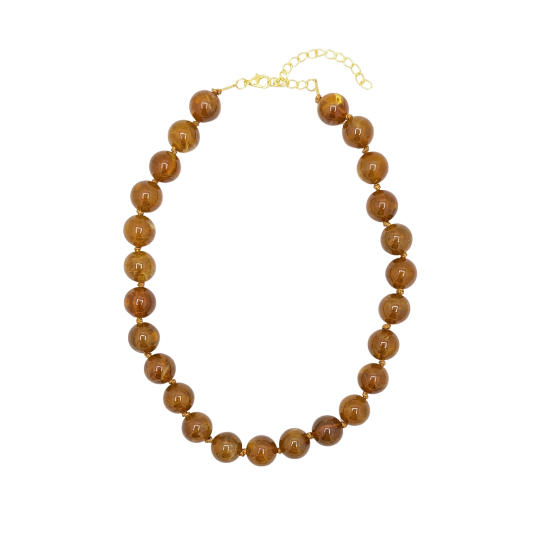 Bruine kralenketting met transparant marble effect en goudkleurige sluiting