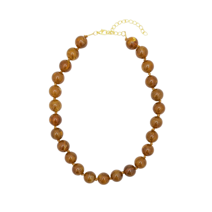 Bruine kralenketting met transparant marble effect en goudkleurige sluiting