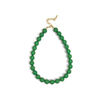 Groene kralenketting met grote glanzende kralen en goudkleurige sluiting