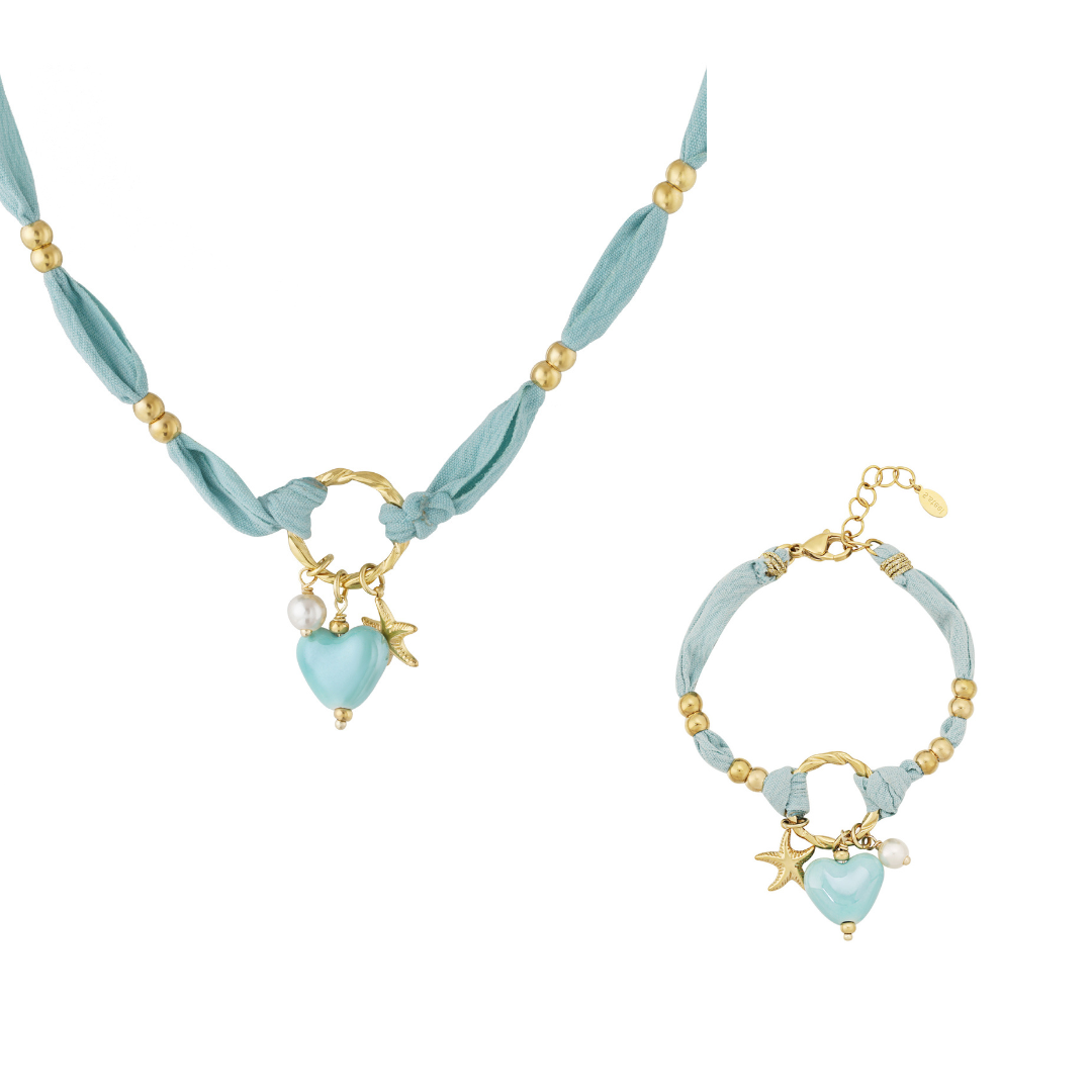 Setje licht blauwe armband ketting van stof met blauw hart gouden zeester en parelkraaltje