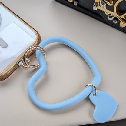Telefoonkoord dubbel hart lichtblauw aan een telefoon 