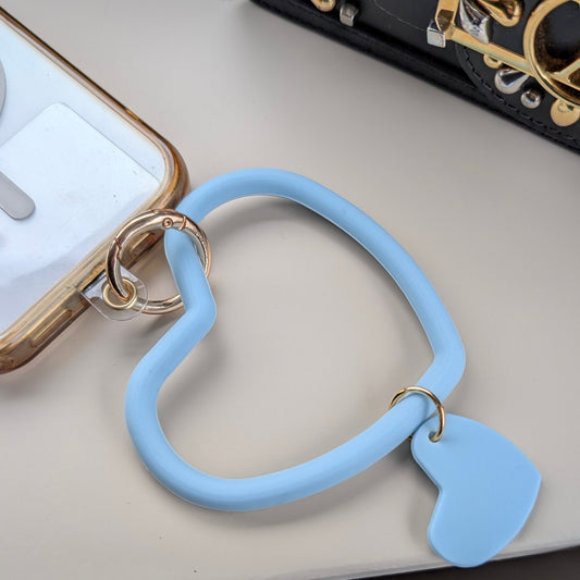 Telefoonkoord dubbel hart lichtblauw aan een telefoon 