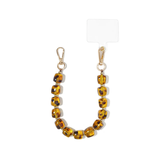 Amber bruin beige telefoonkoord met chunky panter kralen en gouden details van Casa Jadel