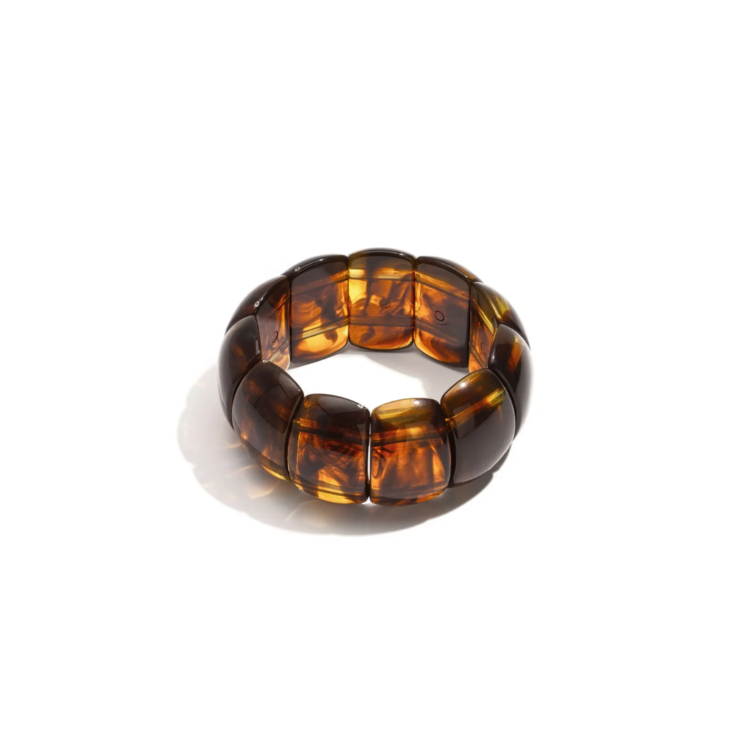 Amber bruine statement armband met grote brede transparante kralen