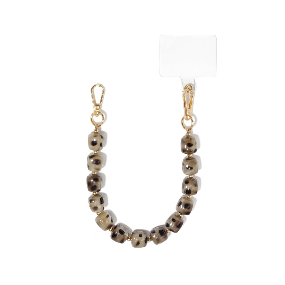 Beige chunky telefoonkoord met vierkante kralen en subtiele luipaardprint van Casa Jadel