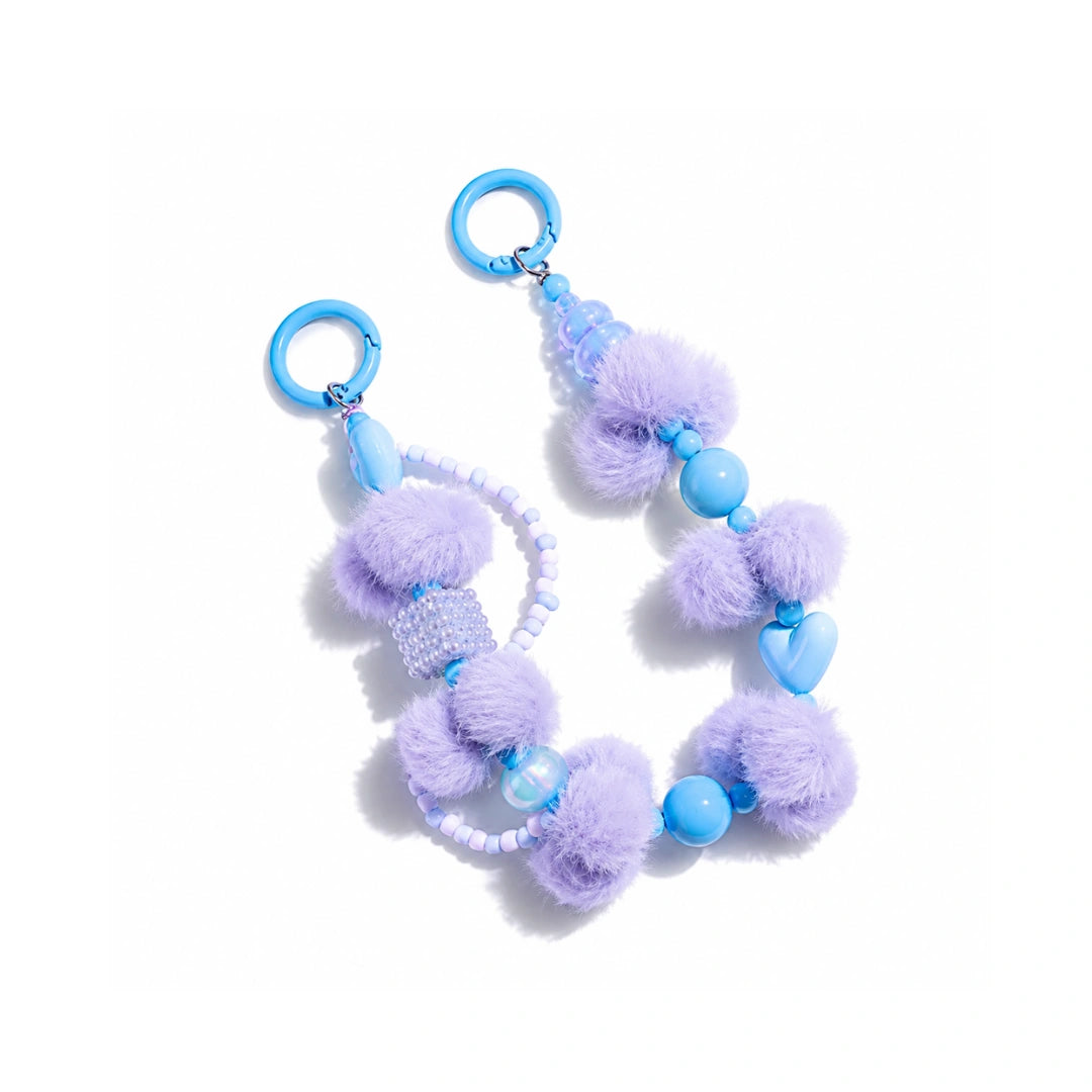 Blauwe pompom en popkralen tashanger