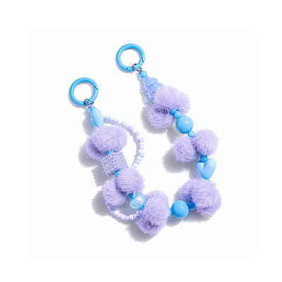 Blauwe pompom en popkralen tashanger