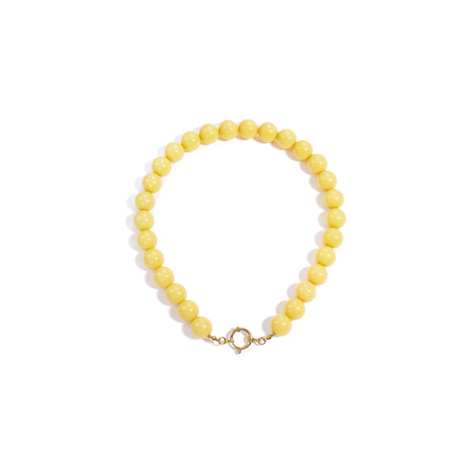 Botergele kralen ketting met goudkleurig boeislot voor dames.