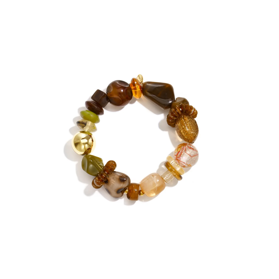 Bruin en groene chunky kralenarmband met verschillende statement kralen en gouden detail
