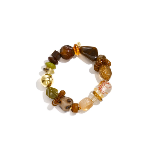 Bruin en groene chunky kralenarmband met verschillende statement kralen en gouden detail